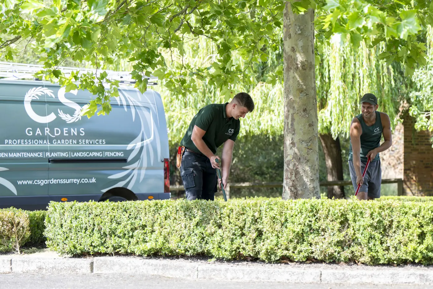 CS Services team maintaining hedges and grounds at a Surrey property